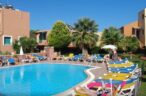 Panoramic pool view with sunbeds