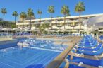 Go swimming in the extensive pool of Iberostar Las Dalias